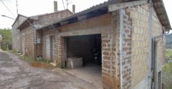 PORZIONE DI CASA CON GARAGE E TERRENO